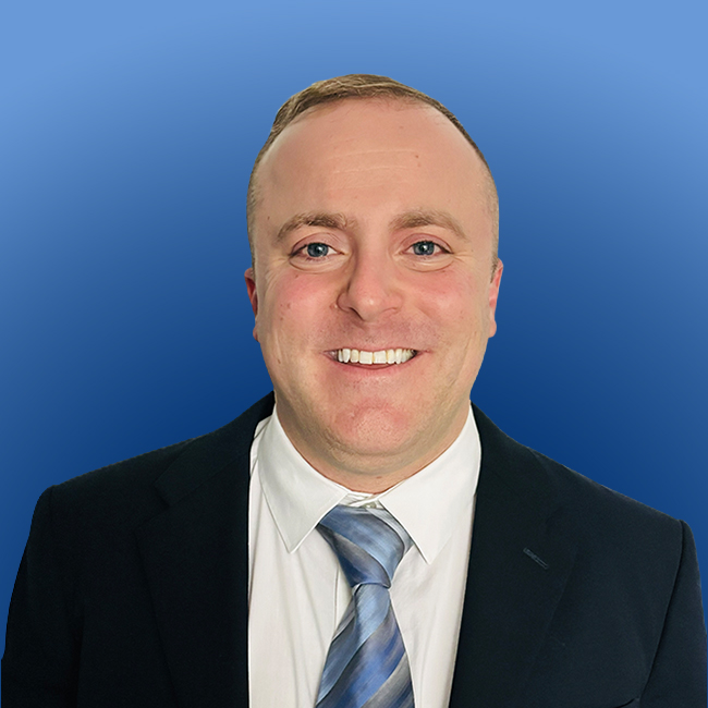 Attorney Peter Massaro headshot in a blue background