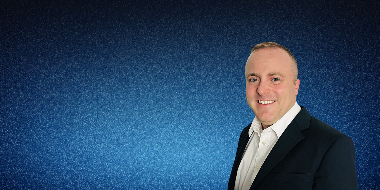 Attorney Peter Massaro in a blue background
